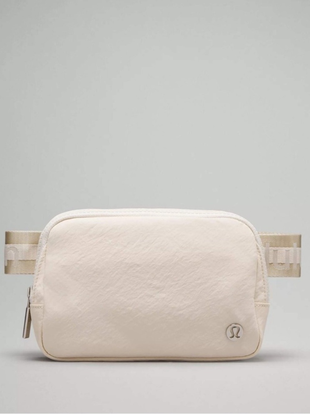 lululemon Everywhere Belt Bag — 1 L. Wordmark limited edition Light Cream.